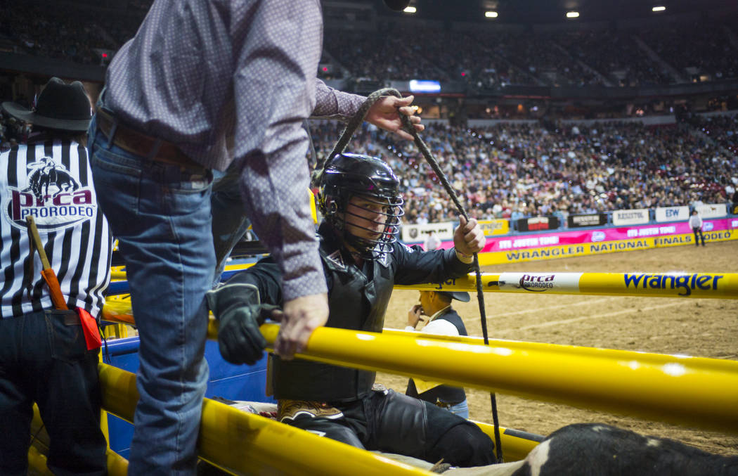 Trevor Reiste prepares to compete in the bull riding event during the second night of the National Finals Rodeo at the Thomas & Mack Center in Las Vegas on Friday, Dec. 8, 2017. Chase Stevens ...