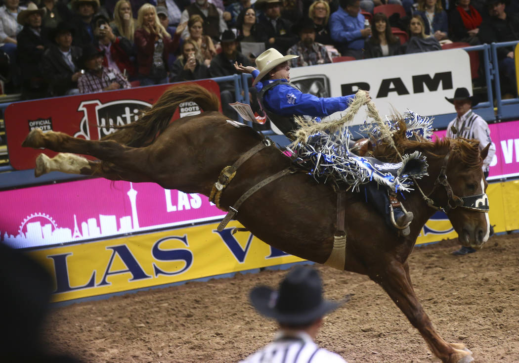 Jesse Wright competes in the saddle bronc riding event during the second night of the National Finals Rodeo at the Thomas & Mack Center in Las Vegas on Friday, Dec. 8, 2017. Chase Stevens Las ...